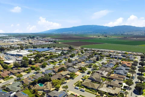 an aerial view of a house with a yard