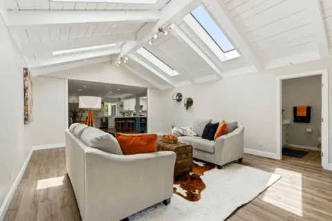 a living room with furniture and a table