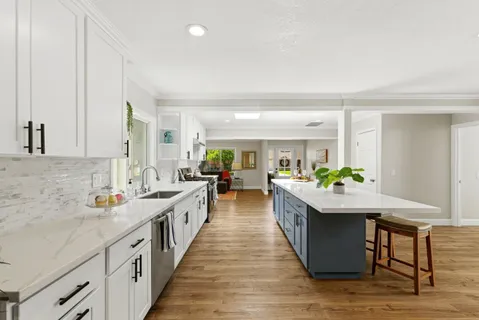 a kitchen with sink and stove