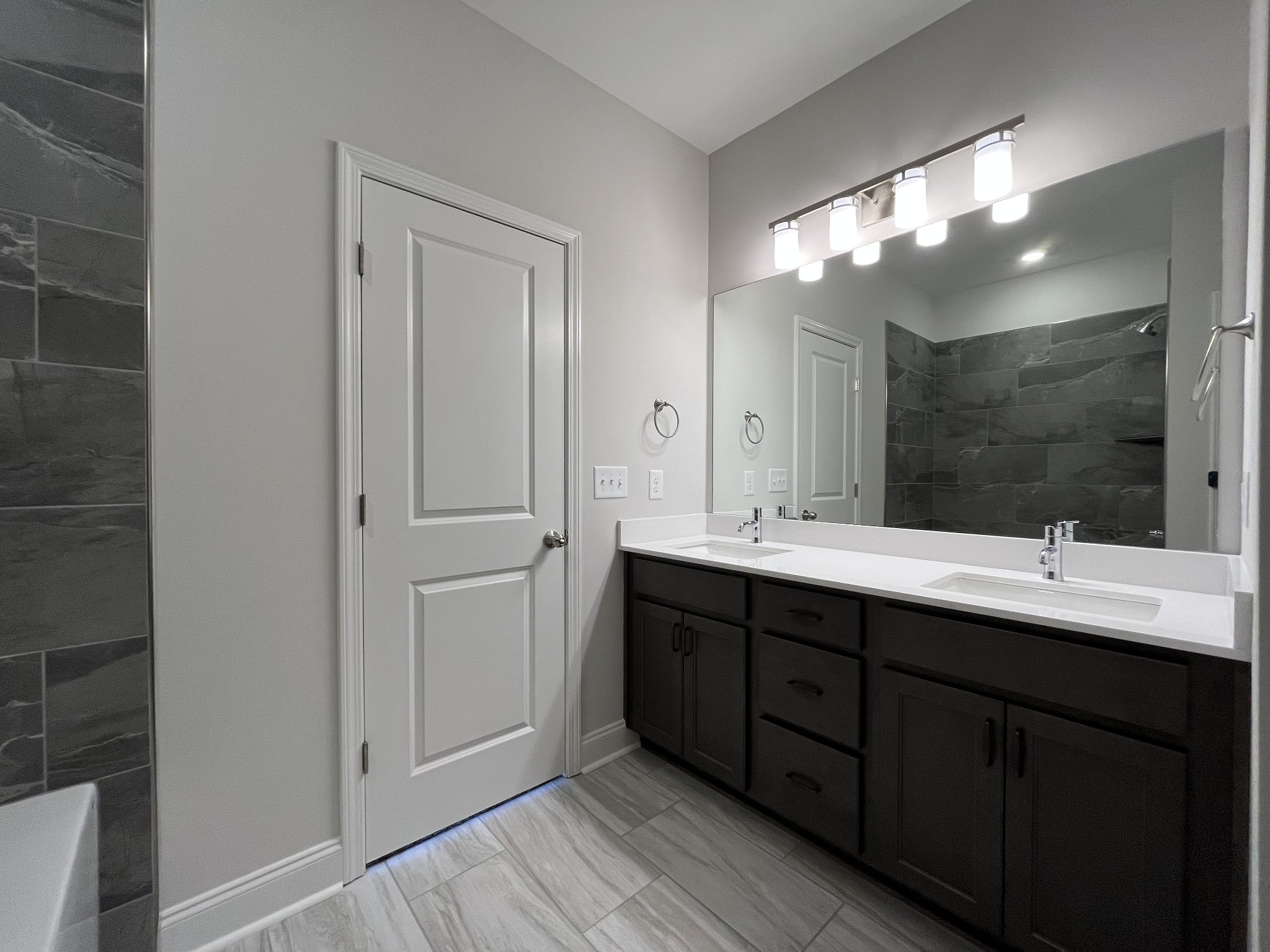 3267 Tasker Drive Antioch, TN 37013 - Photo 18 of 44 a bathroom with a double vanity sink and mirror