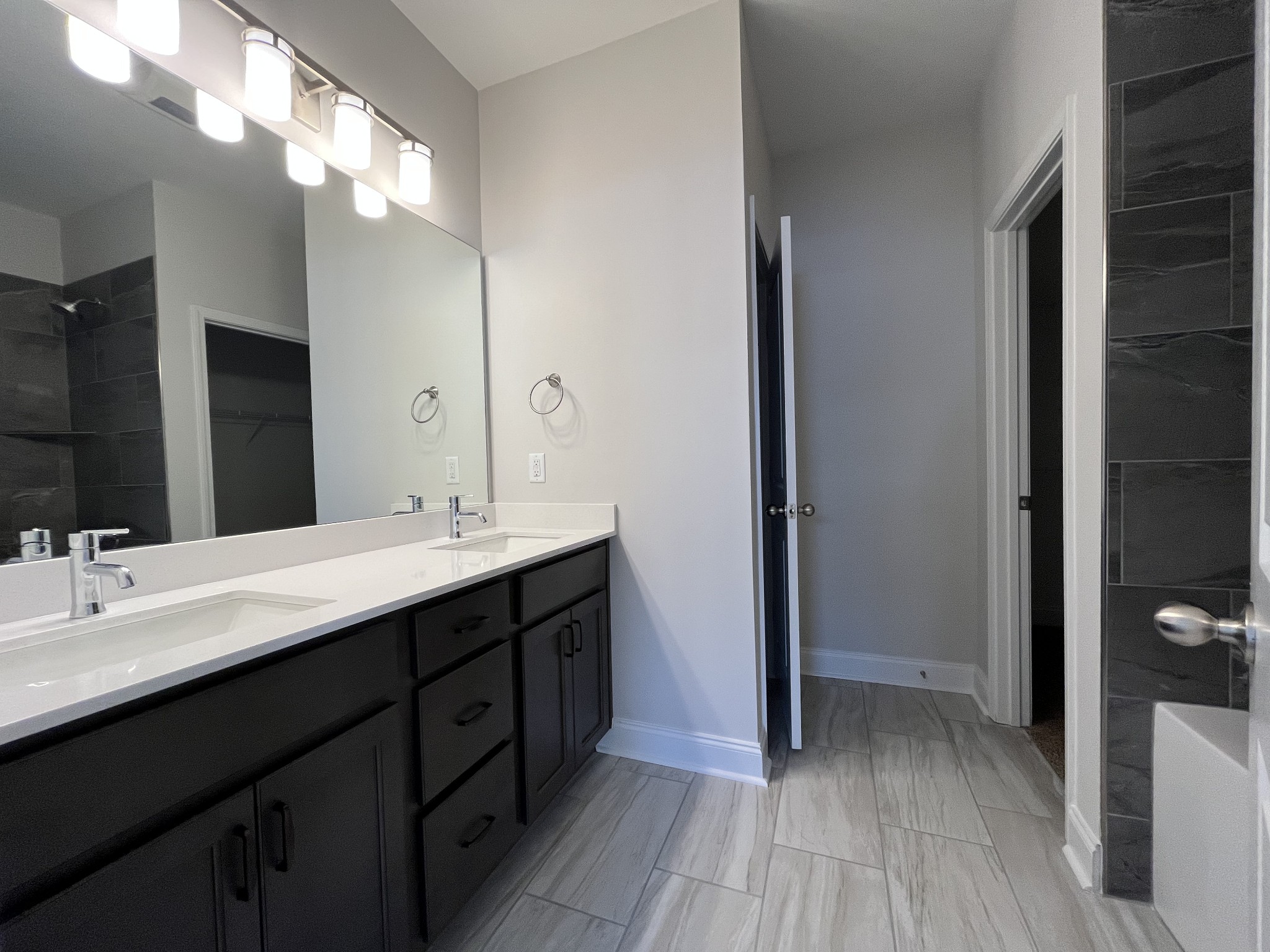3267 Tasker Drive Antioch, TN 37013 - Photo 20 of 44 a bathroom with a double vanity sink and mirror