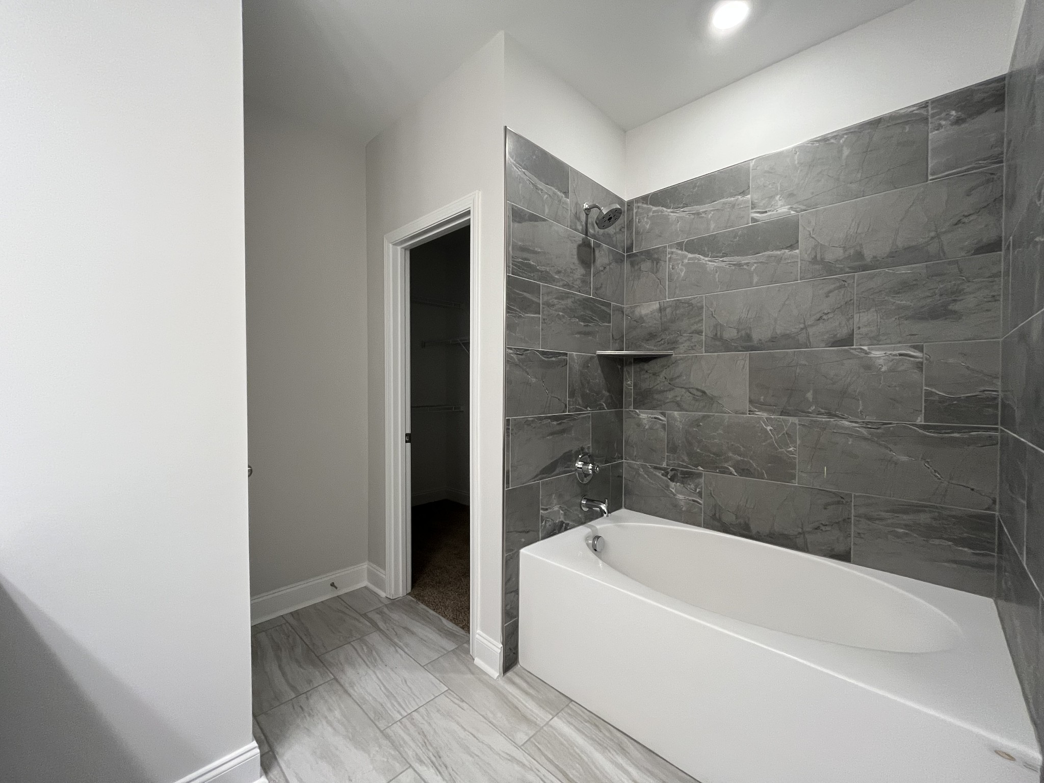 3267 Tasker Drive Antioch, TN 37013 - Photo 22 of 44 a bathroom with a bathtub and a shower