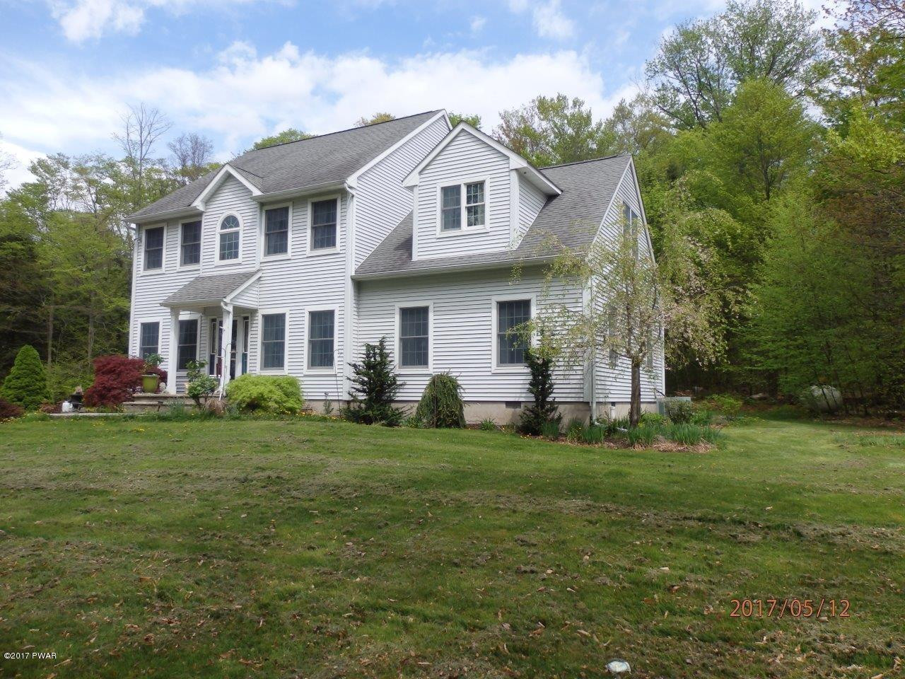 271 Sawmill Road Greentown, PA 18426 - Photo 27 of 36 a front view of a house with a garden