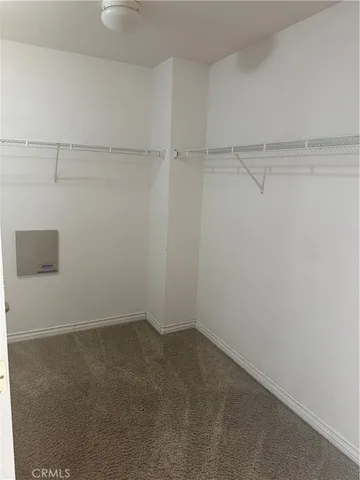 a view of a room with shelf on the wall