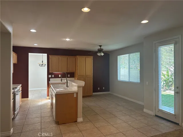 a kitchen with stainless steel appliances granite countertop a stove and a refrigerator