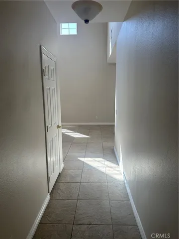 an empty room with a mirror