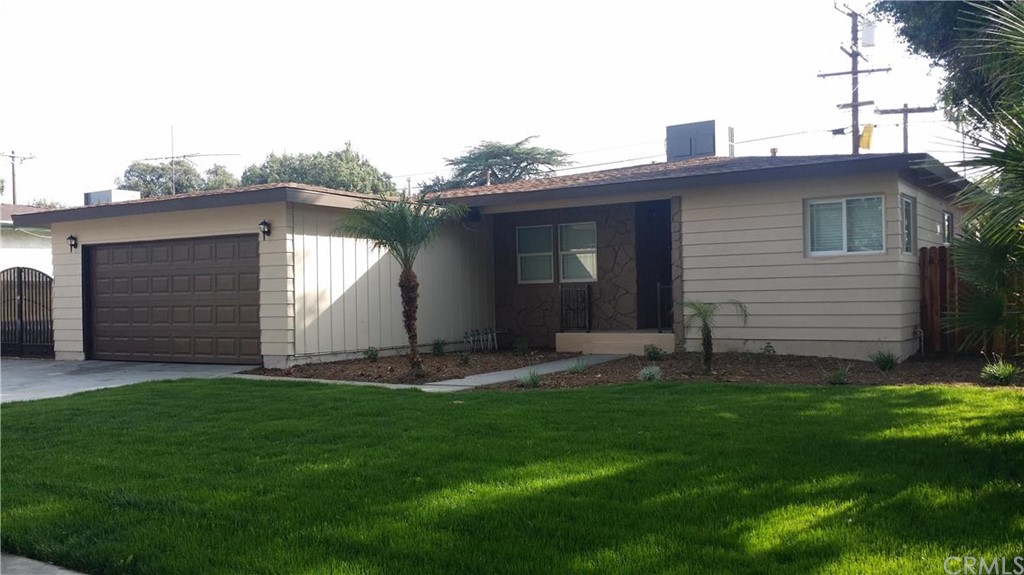 3626 Ross Street Riverside, CA 92503 - Photo 1 of 1 a front view of a house with a yard and garage