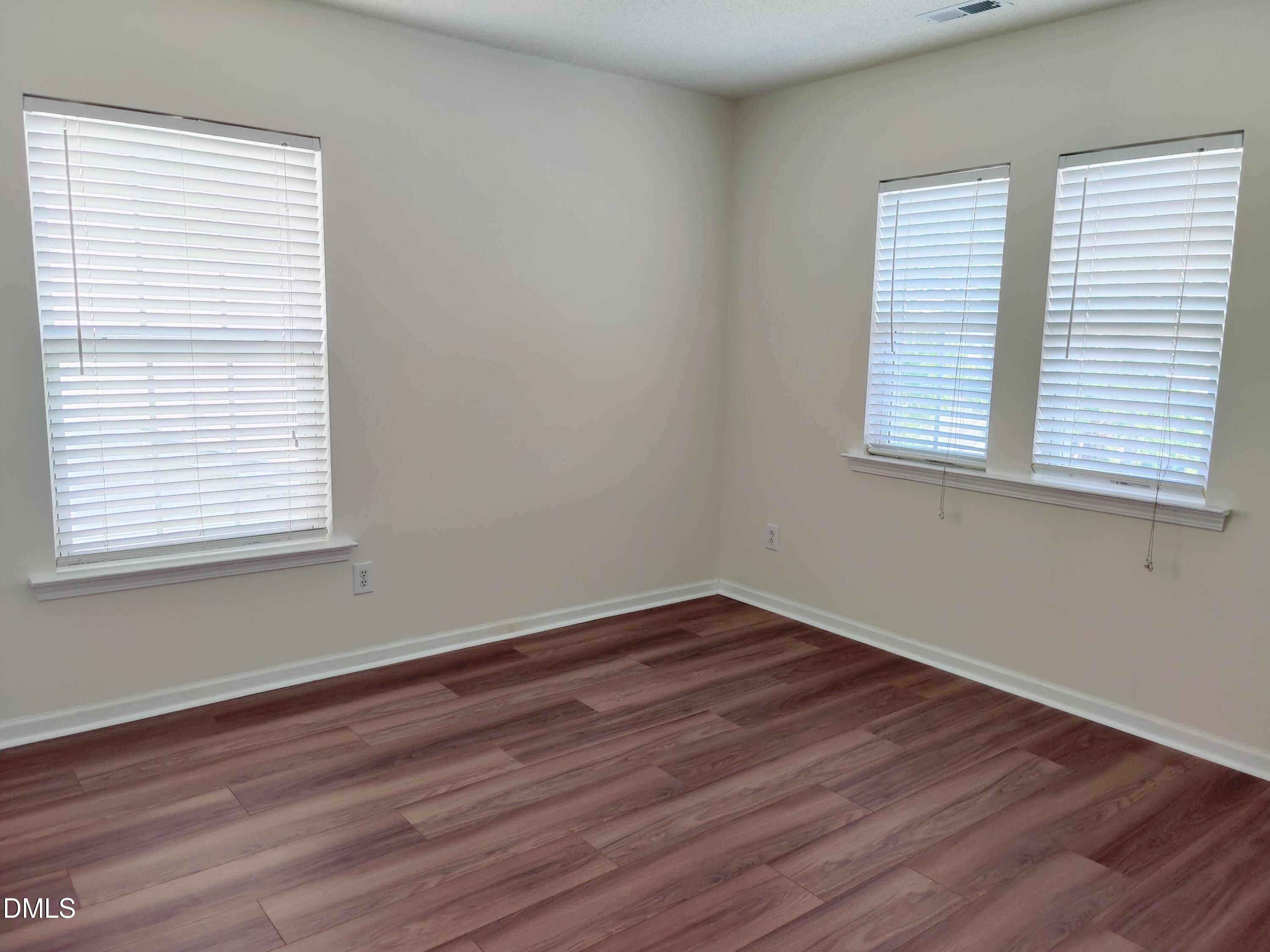 4011 Oatgrass Lane Raleigh, NC 27604 - Photo 16 of 21 wooden floor in an empty room with a window
