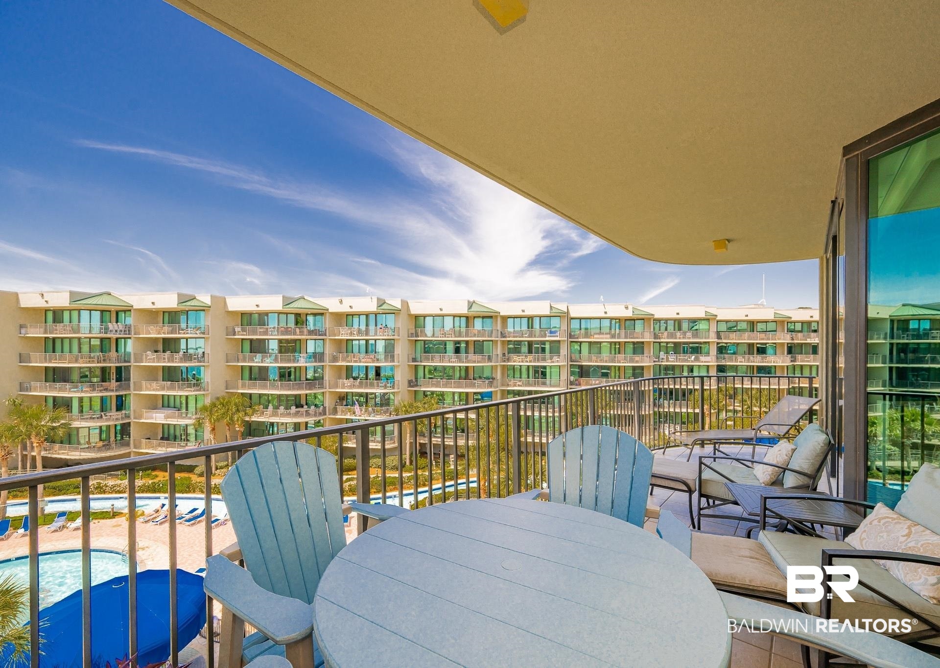 27580 Canal Road, Unit 1429 Orange Beach, AL 36561 - Photo 15 of 45 Balcony featuring view of pool and outdoor dining space