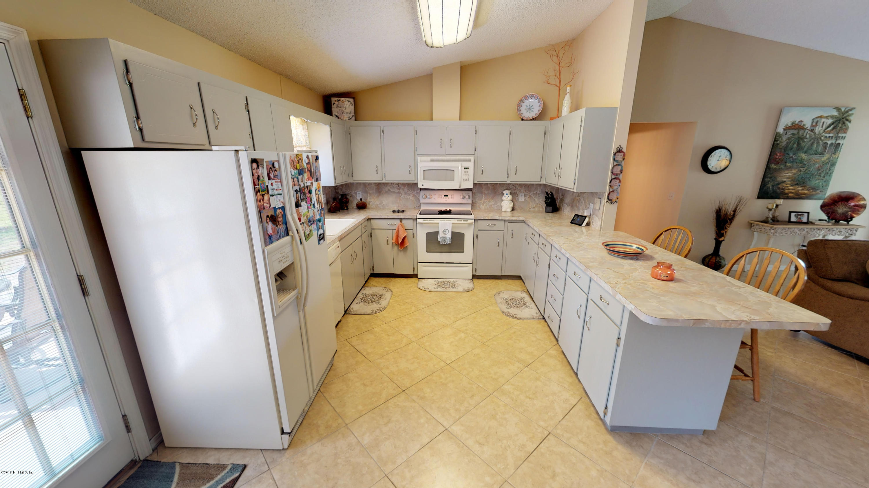 5175 Scaff Road St. Augustine, FL 32092 - Photo 15 of 20 a bed room with a bed and a window