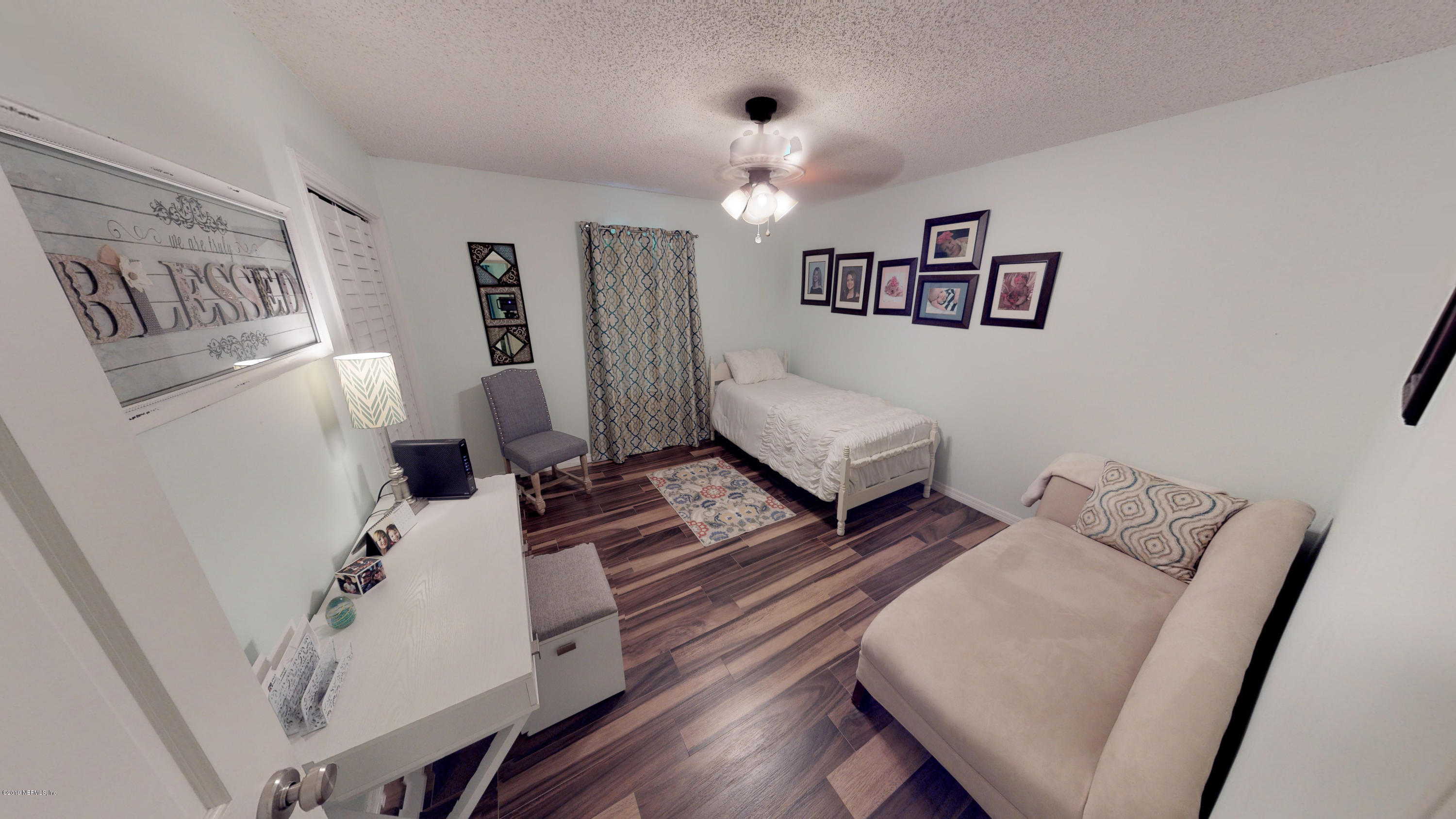 5175 Scaff Road St. Augustine, FL 32092 - Photo 19 of 20 a living room with furniture and a wooden floor