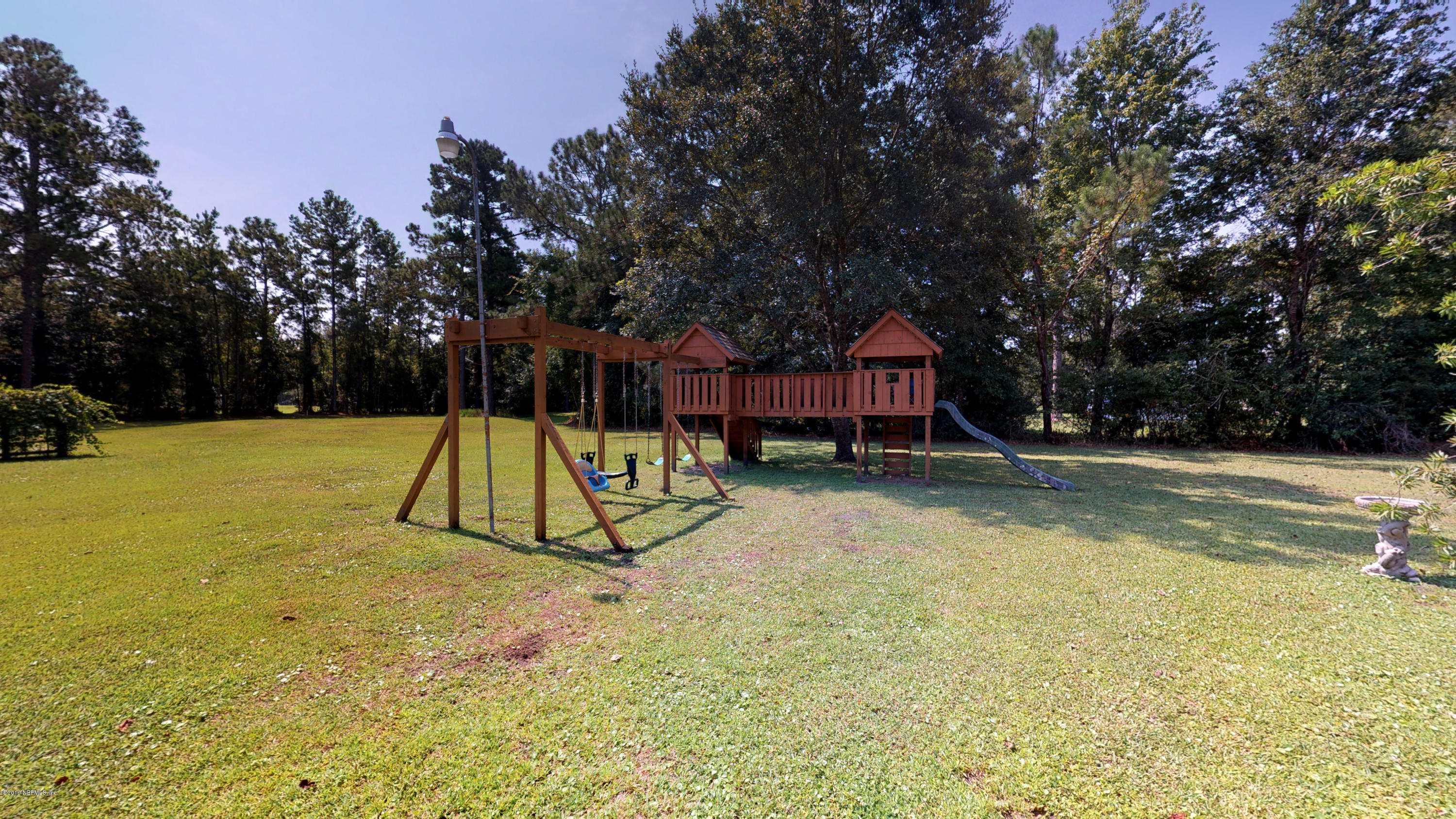 5175 Scaff Road St. Augustine, FL 32092 - Photo 6 of 20 a view of swimming pool with a yard and trees