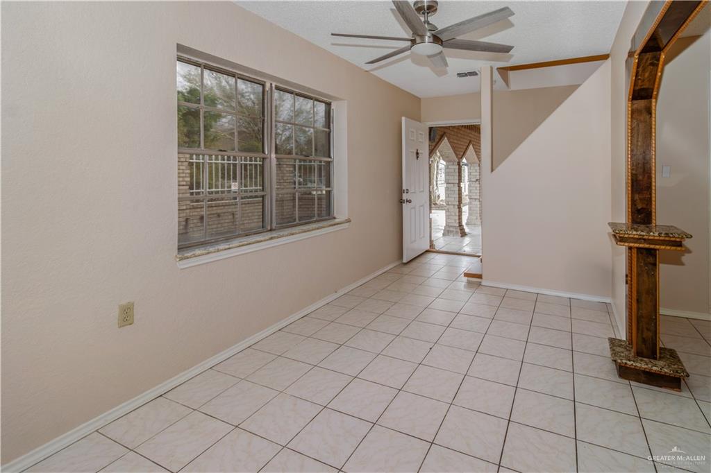 207 East Saenz Avenue Pharr, TX 78577 - Photo 16 of 21 a view of a livingroom with an empty space and a window