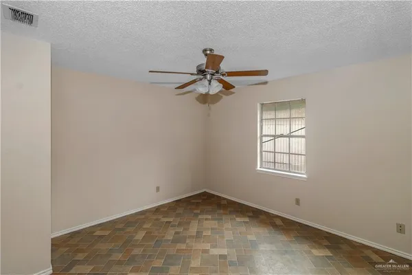 a view of empty room with windows