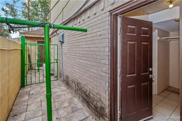 a view of a wooden door with a tree