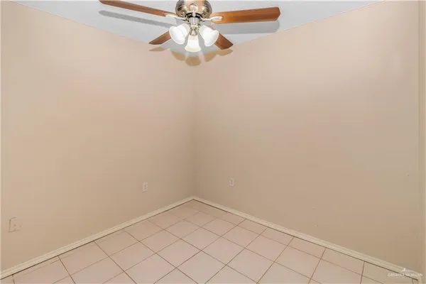 an empty room with a fan