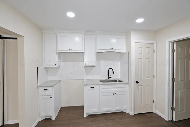 a bathroom with a sink double vanity and a mirror