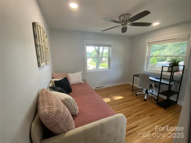 a bedroom with furniture and a window