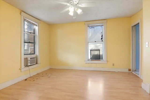 a view of an empty room with a window