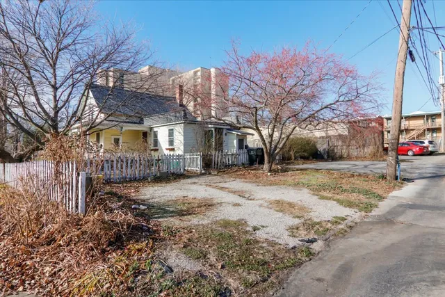 a view of a large trees in front of a house