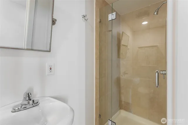 a bathroom with a sink and shower