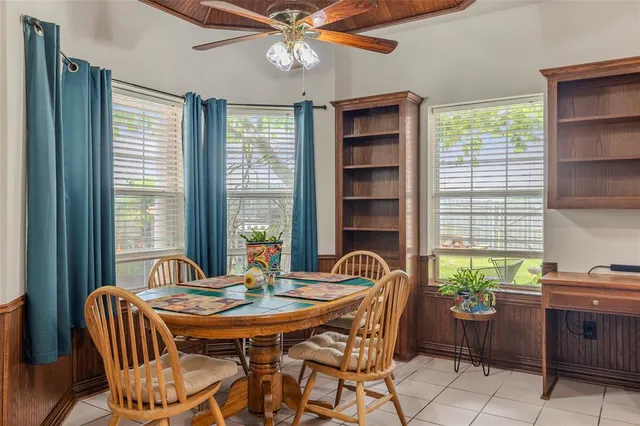 a dining room with furniture and window