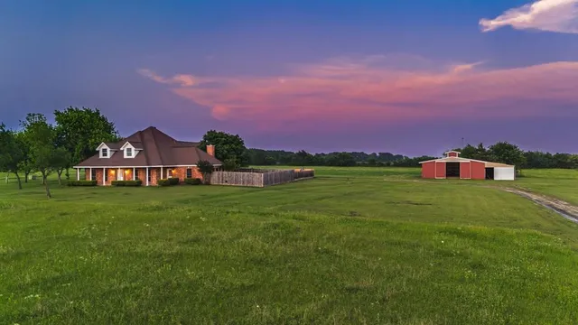 a view of a house with a big yard