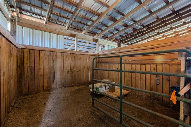 a view of a room with wooden walls