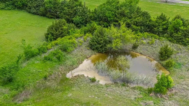 a view of a lake with a yard