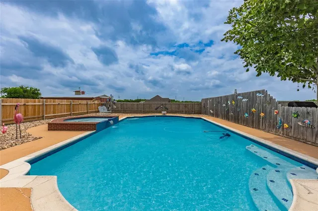 a view of a mini pool with an outdoor seating