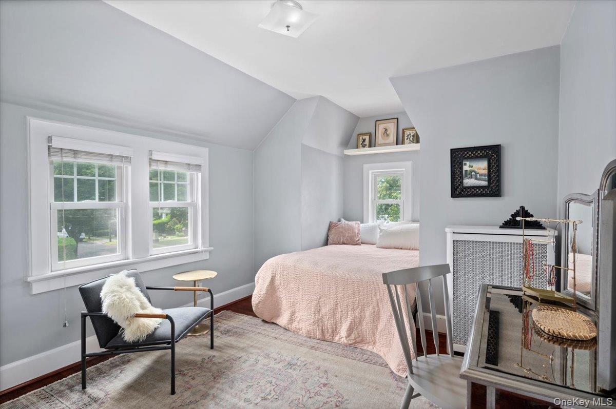 400 Manor Ridge Road Pelham, NY 10803 - Photo 14 of 39 a bedroom with a bed and a chair