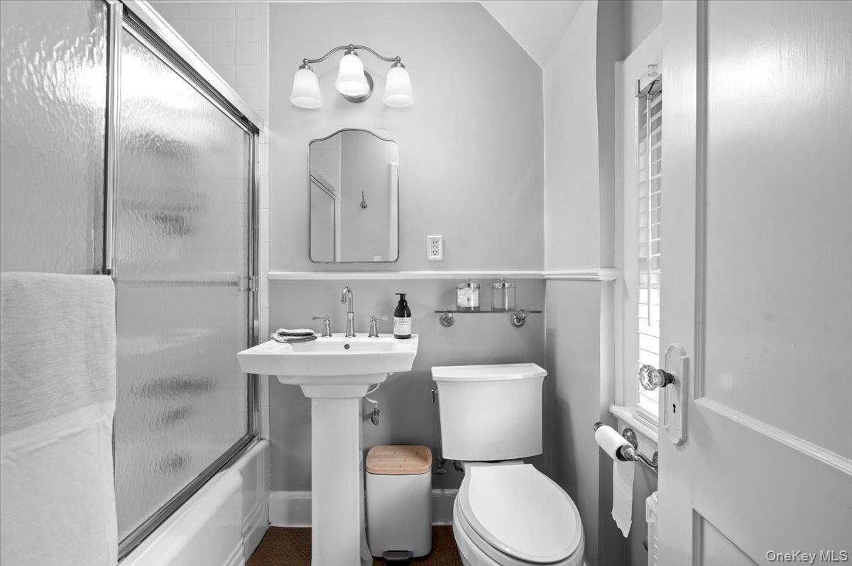 400 Manor Ridge Road Pelham, NY 10803 - Photo 15 of 39 a bathroom with a toilet sink and mirror