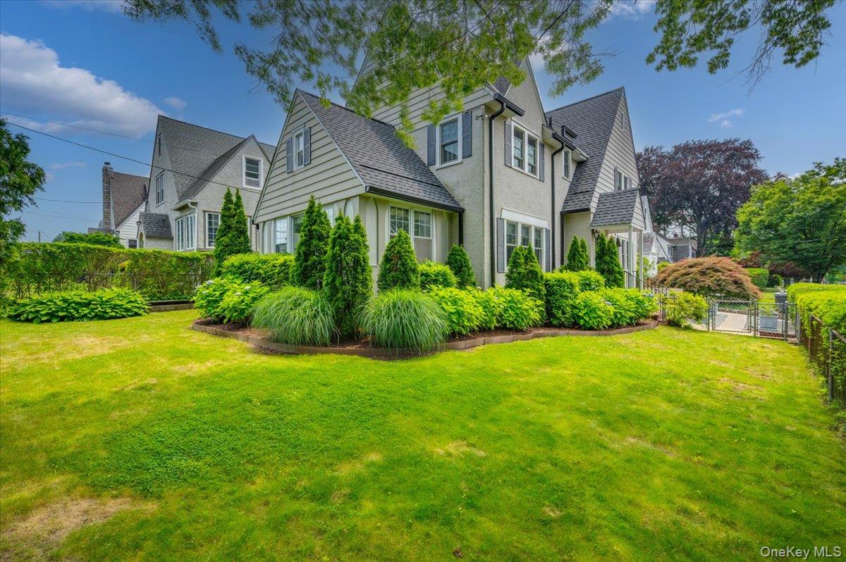 400 Manor Ridge Road Pelham, NY 10803 - Photo 24 of 39 a front view of a house with garden