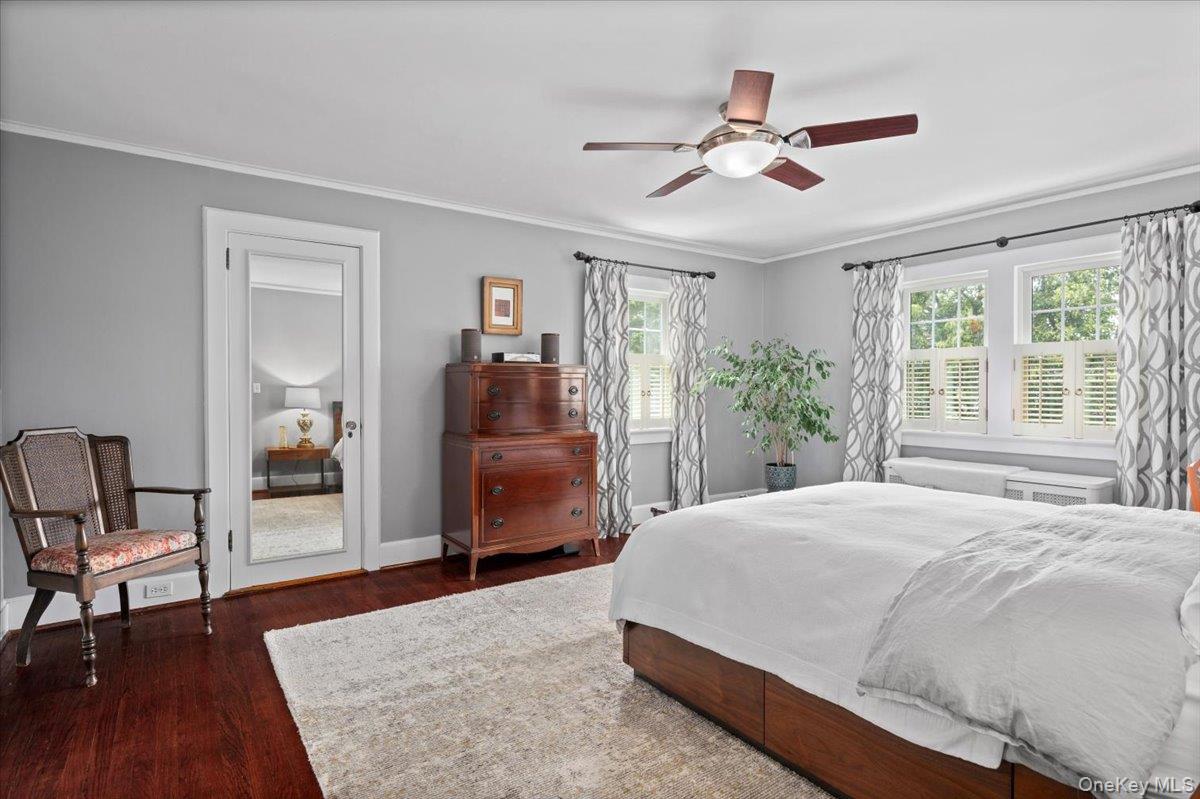 400 Manor Ridge Road Pelham, NY 10803 - Photo 28 of 39 a bedroom with a bed and wooden floor