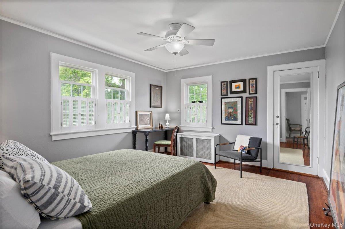 400 Manor Ridge Road Pelham, NY 10803 - Photo 31 of 39 a spacious bedroom with a bed and window
