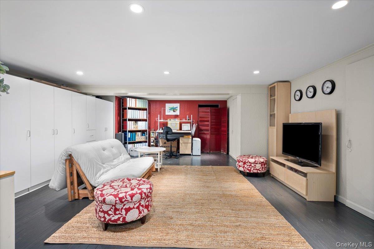 400 Manor Ridge Road Pelham, NY 10803 - Photo 32 of 39 a living room with furniture and a flat screen tv