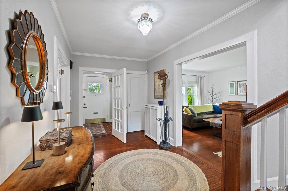 400 Manor Ridge Road Pelham, NY 10803 - Photo 9 of 39 a living room with furniture a rug and a chandelier