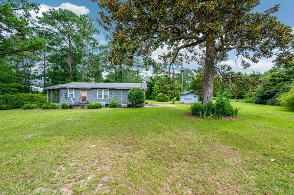 a view of a house with a big yard