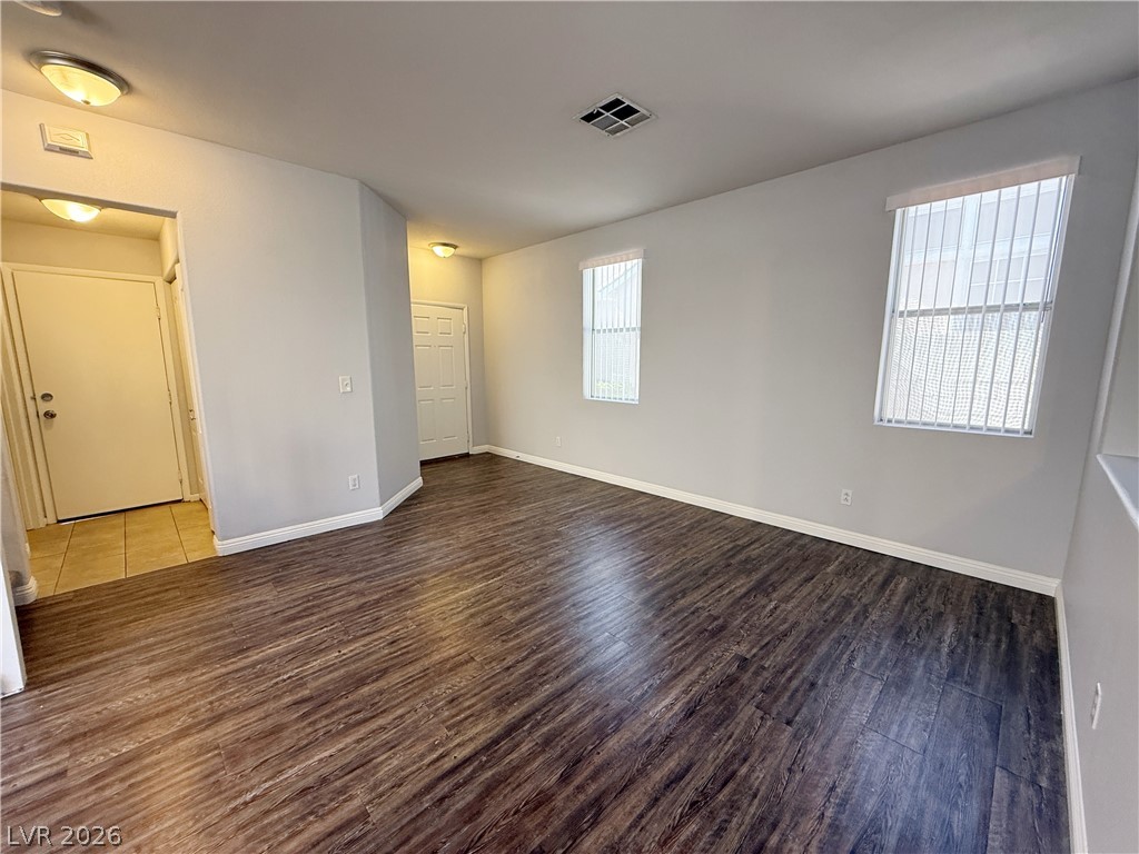 2185 Polynesia Circle Henderson, NV 89074 - Photo 2 of 37 Rich hardwood flooring grounds this inviting living space, providing an excellent foundation for any design.