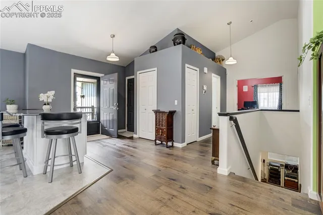 a view of a livingroom with furniture and a ceiling fan