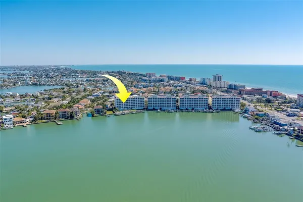 an aerial view of a house with a ocean view