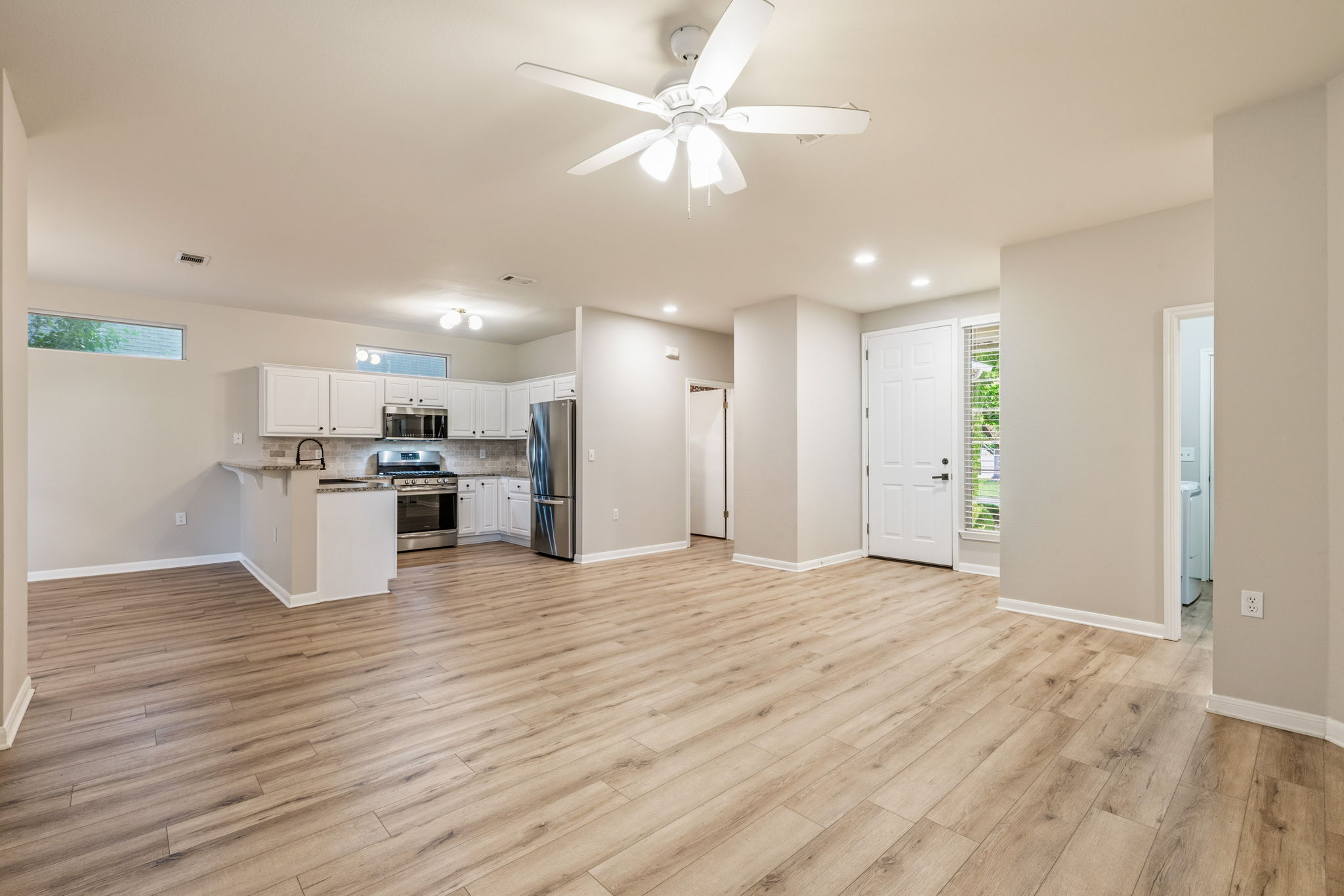 137 Trail Rider Way Georgetown, TX 78633 - Photo 29 of 29 An open floorplan seamlessly connects the kitchen and living areas, offering effortless movement and abundant light.