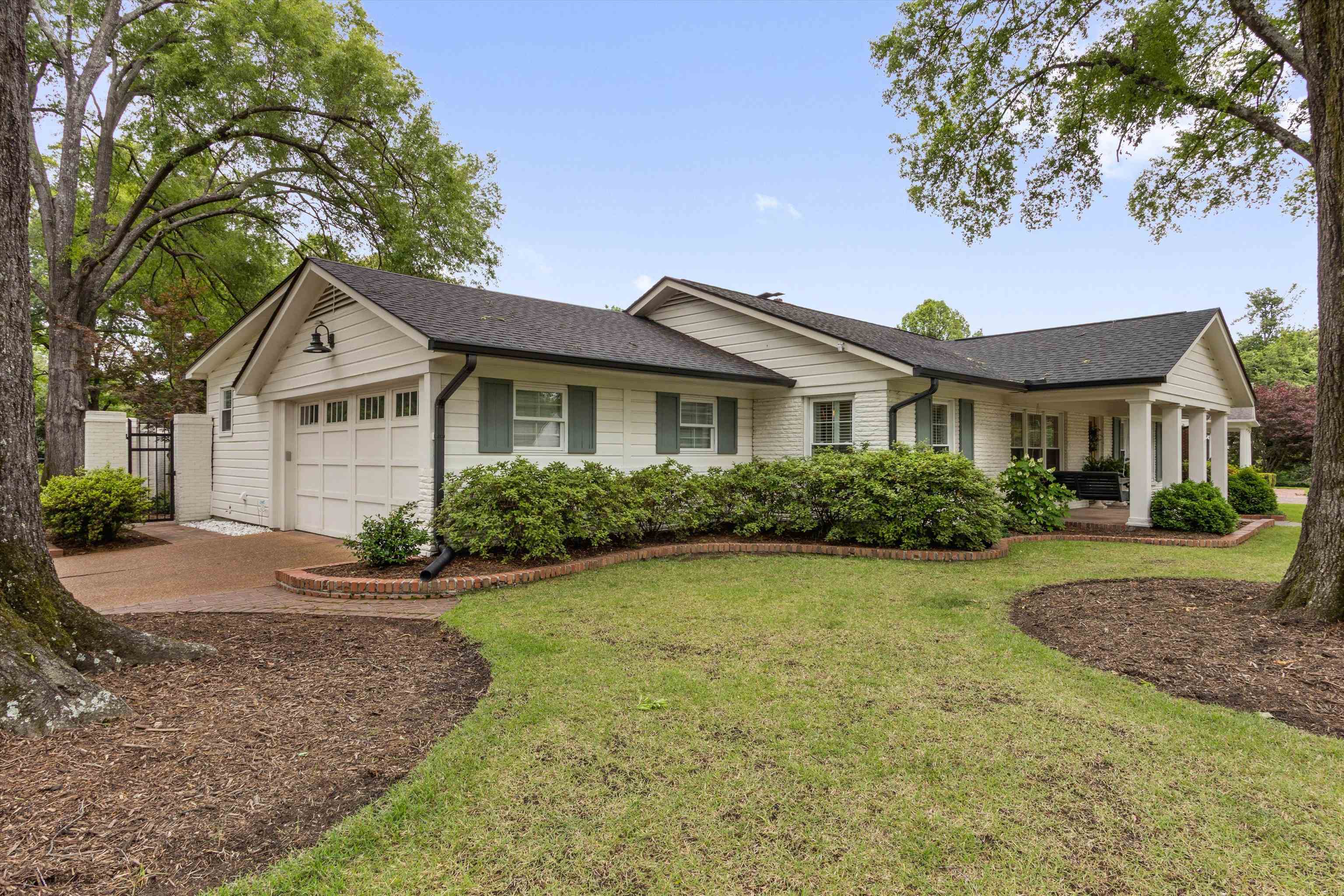 4678 Chickasaw Road Memphis, TN 38117 - Photo 35 of 39 White exterior with dark roof and light green shutters