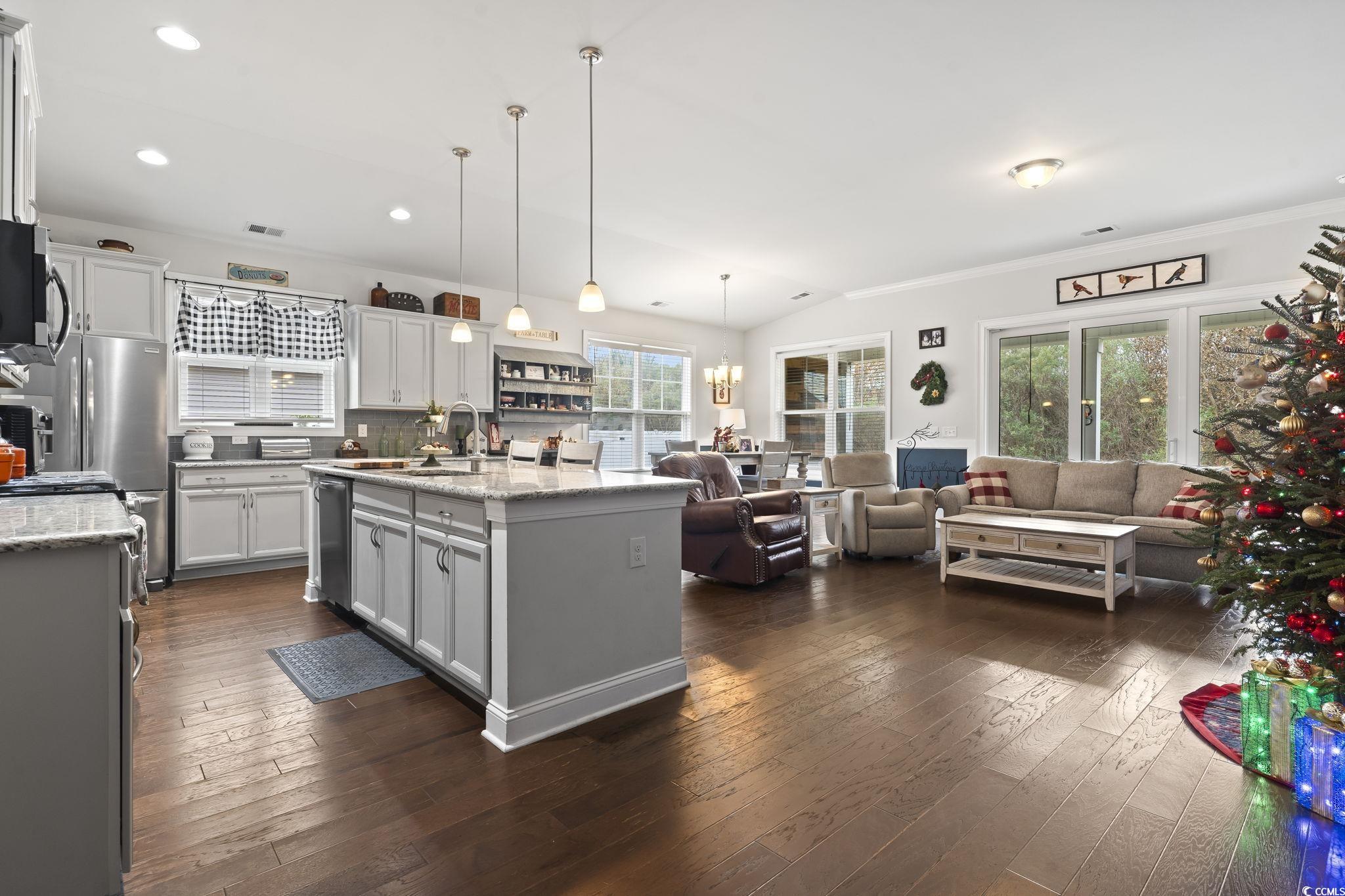 144 Bucky Loop Murrells Inlet, SC 29576 - Photo 11 of 40 Kitchen with light stone countertops, vaulted ceil