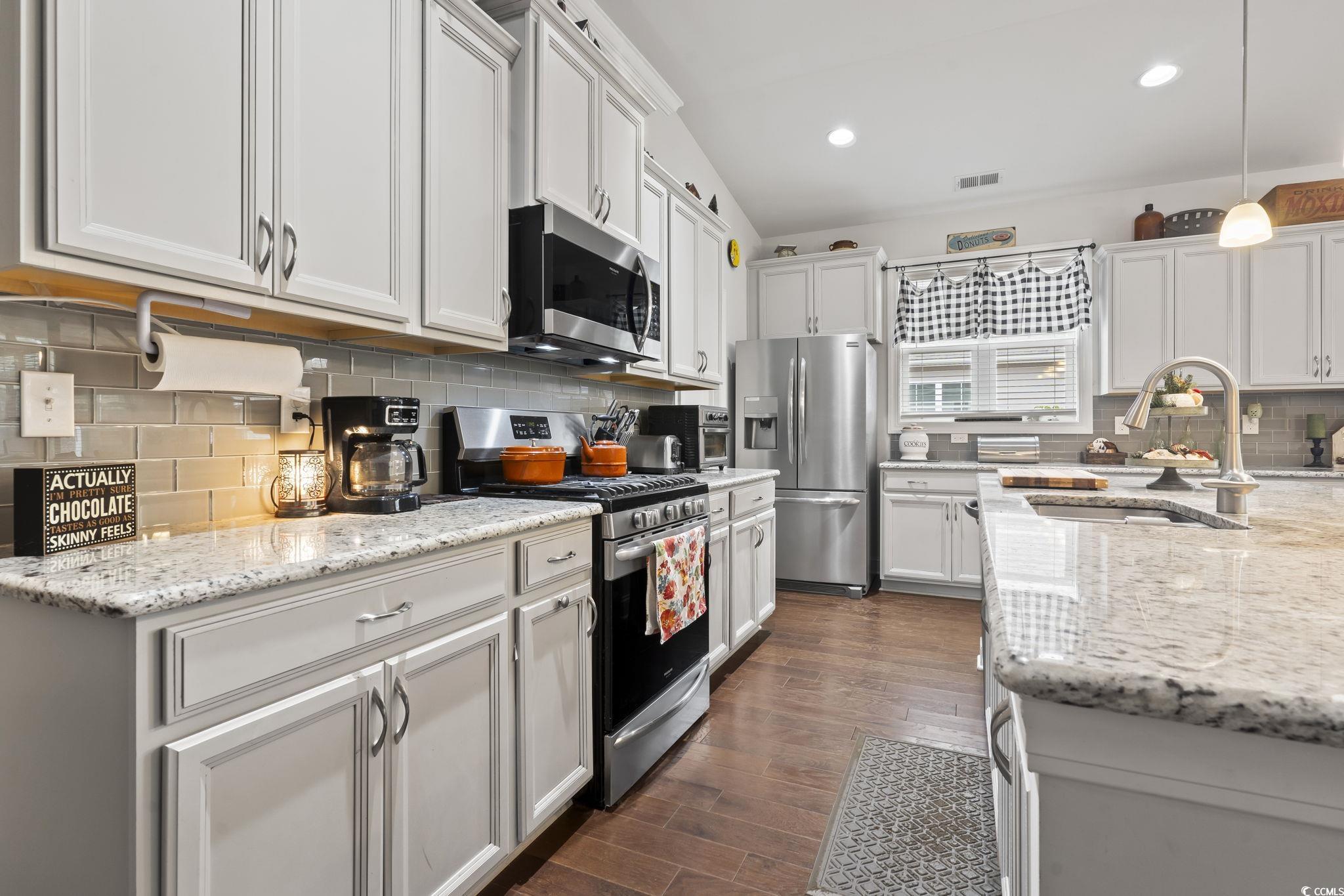 144 Bucky Loop Murrells Inlet, SC 29576 - Photo 15 of 40 Kitchen with dark hardwood / wood-style flooring,