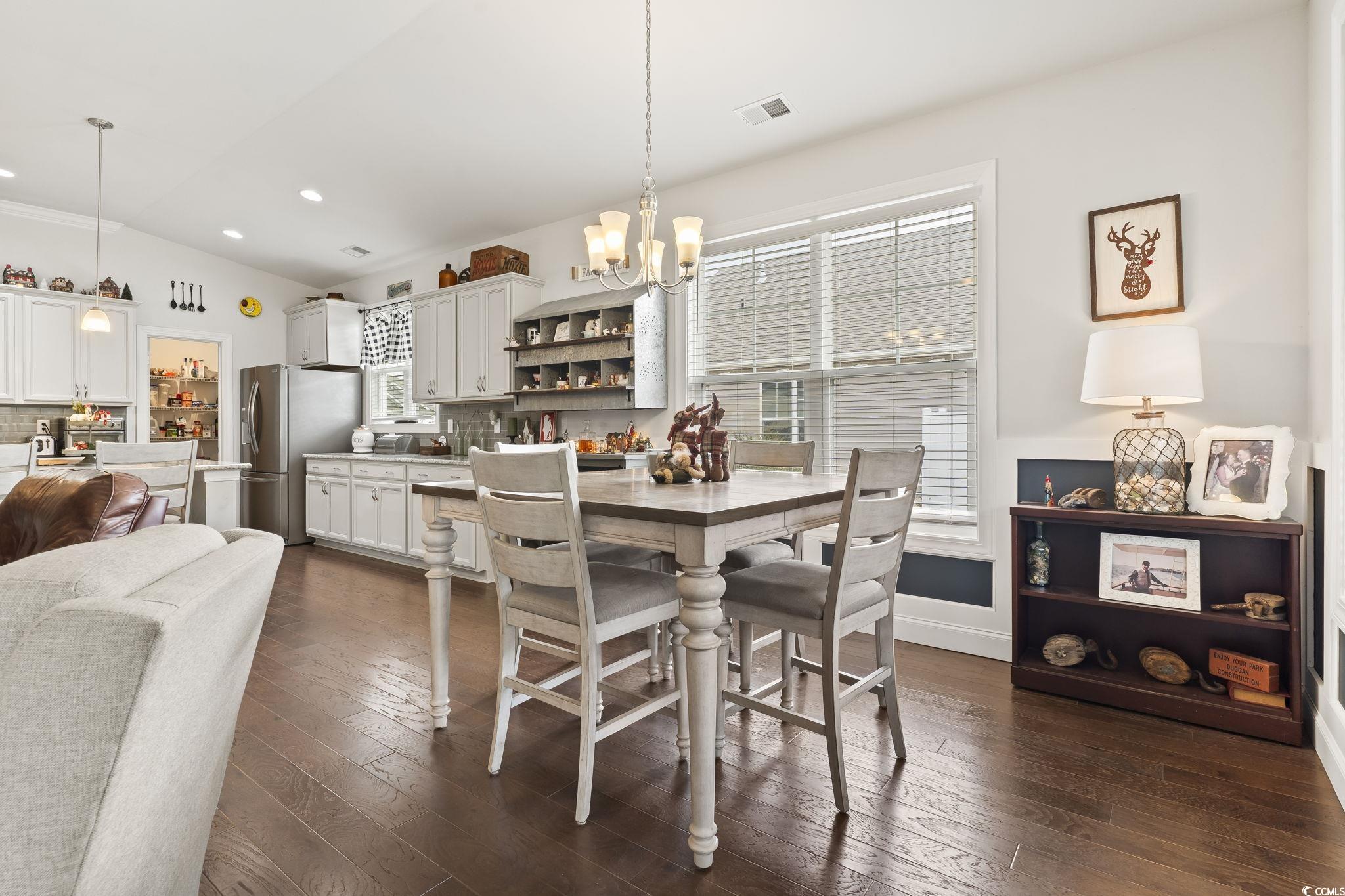 144 Bucky Loop Murrells Inlet, SC 29576 - Photo 16 of 40 Dining room with a notable chandelier, a healthy a