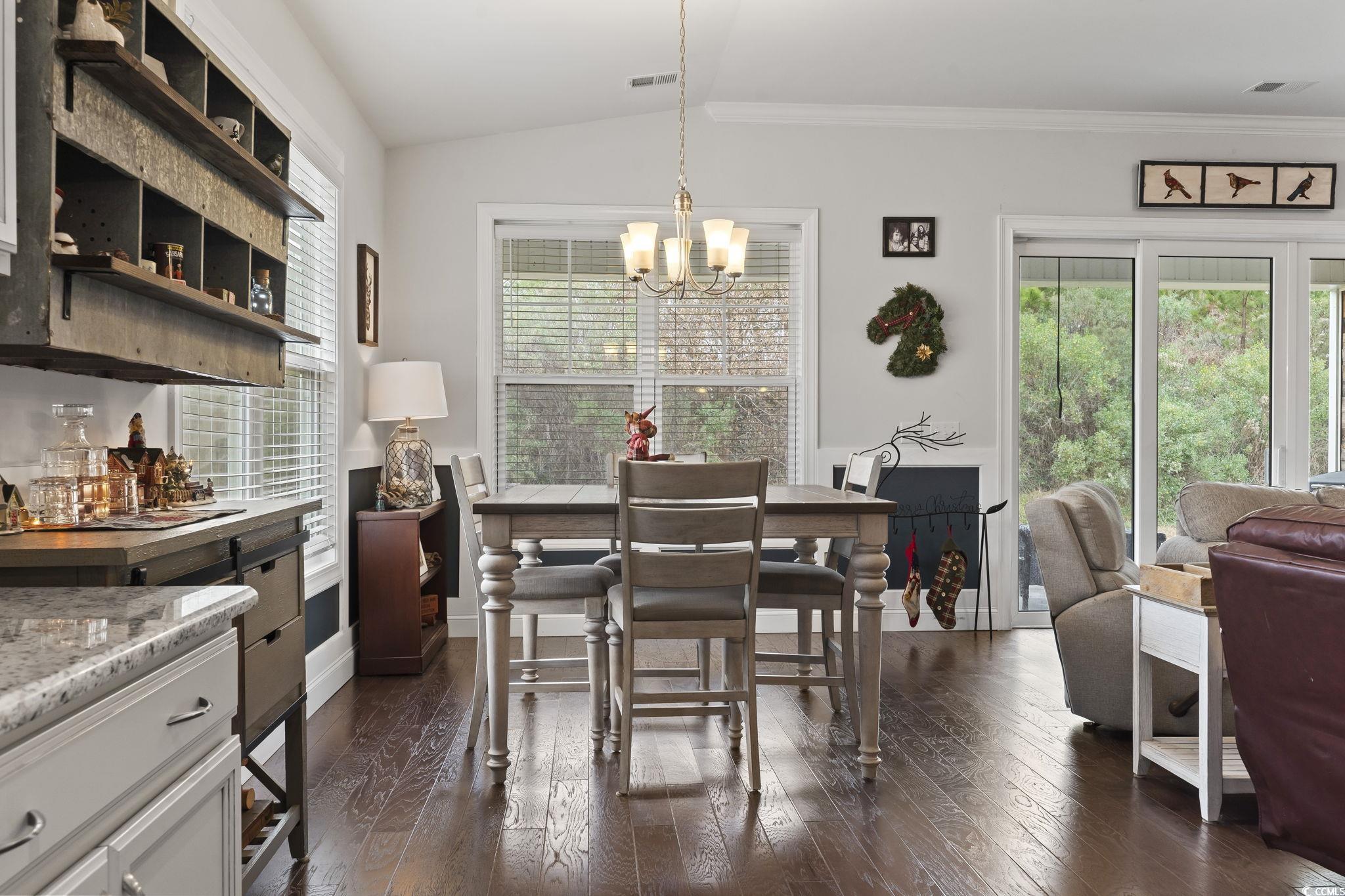 144 Bucky Loop Murrells Inlet, SC 29576 - Photo 17 of 40 Dining area with ornamental molding, dark hardwood