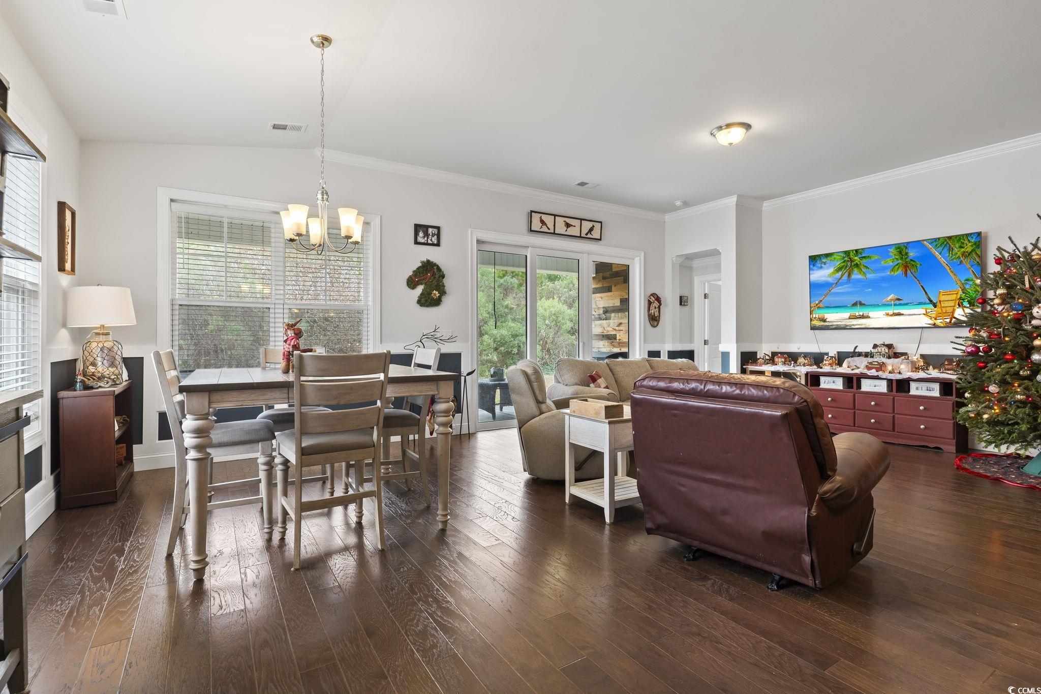 144 Bucky Loop Murrells Inlet, SC 29576 - Photo 18 of 40 Living room with lofted ceiling, ornamental moldin
