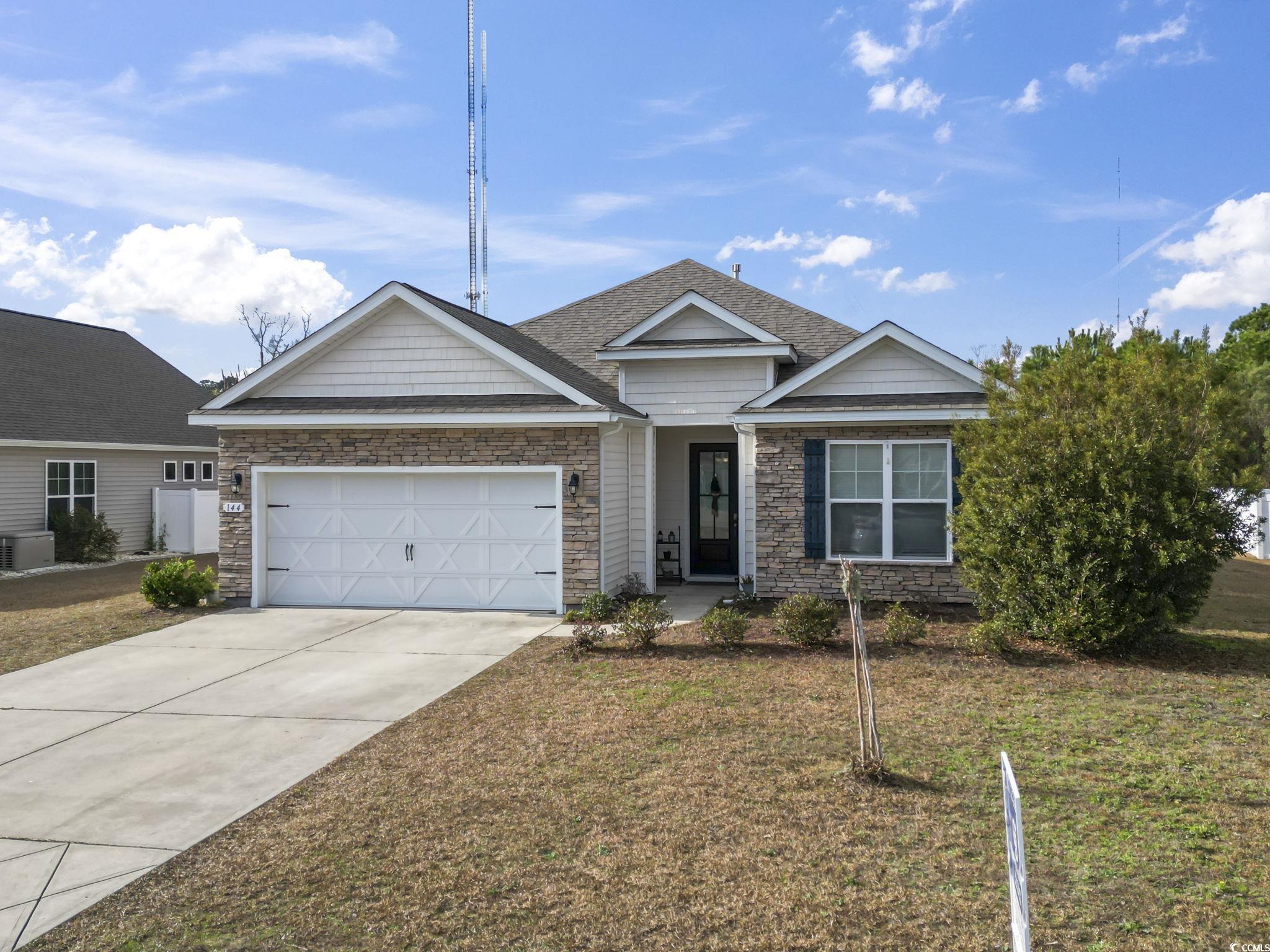 144 Bucky Loop Murrells Inlet, SC 29576 - Photo 2 of 40 View of front of property featuring a garage and a