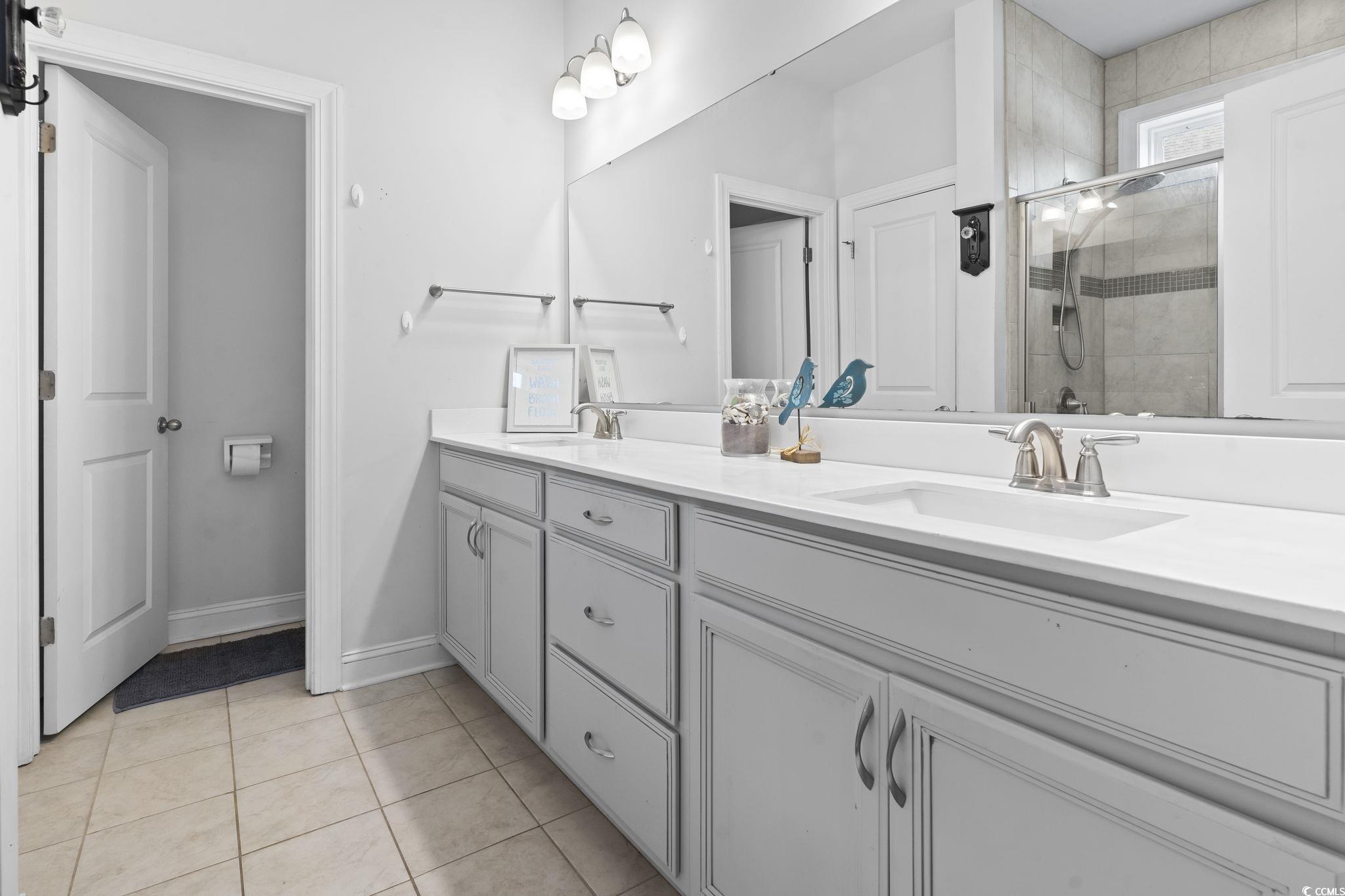144 Bucky Loop Murrells Inlet, SC 29576 - Photo 25 of 40 Bathroom featuring tile patterned floors, vanity,
